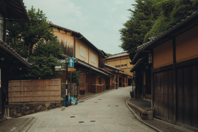 Quiet traditional street in Kyoto, showcasing historic Japanese architecture.